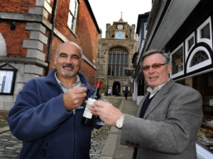Friends reunited: Winchelsea's Richard Commotto and Rye's Anthony Kimber toast the successful renovation of Rye's landmark clock