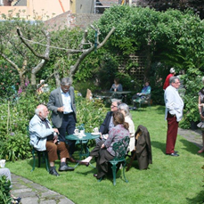 Conservation conversations: partygoers enjoying the beautiful garden