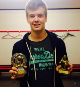 15 year old Joe Fraser with both his player of the year award for the 4th team and his award for his century against  St Peters. 