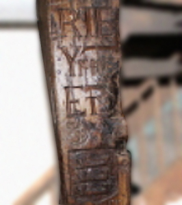 Original Supporting post, note spelling of Rye and carving of the Cinque Ports symbol. 