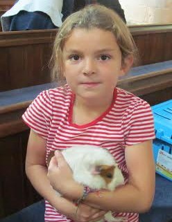Tiffany Waller with guinea pig at St Mary's pet service