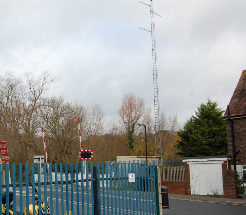 Telecommunication mast at railway crossing