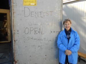 Diana Hajikakou at the entrance to the shippingcontainer at Diavata refugee camp
