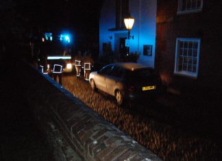 Parked cars block firemen