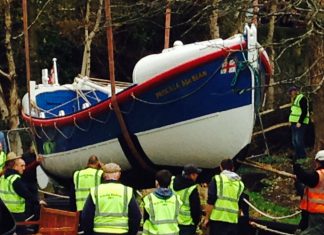 Lifeboat takes to the streets The Pricisilla MacBean lifeboat is lowered into dry dock