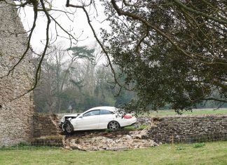 Car thief rams ancient wall