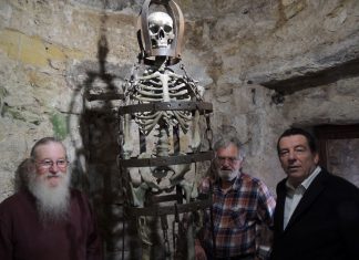 Three men and a skeleton