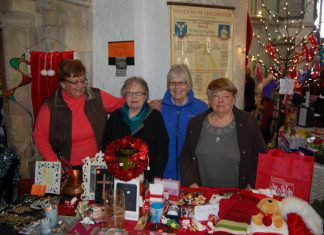 Community charity shop re-opens