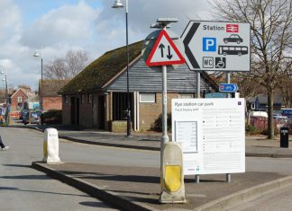 Exit one unreadable notice station car park - close-up