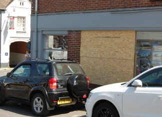 Man falls through window