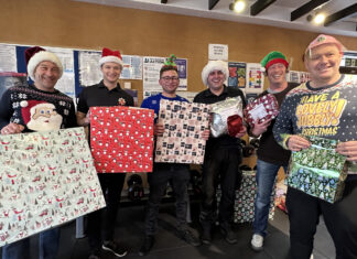 Firefighters helping Father Christmas