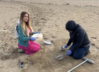 Helping the clear-up at Camber